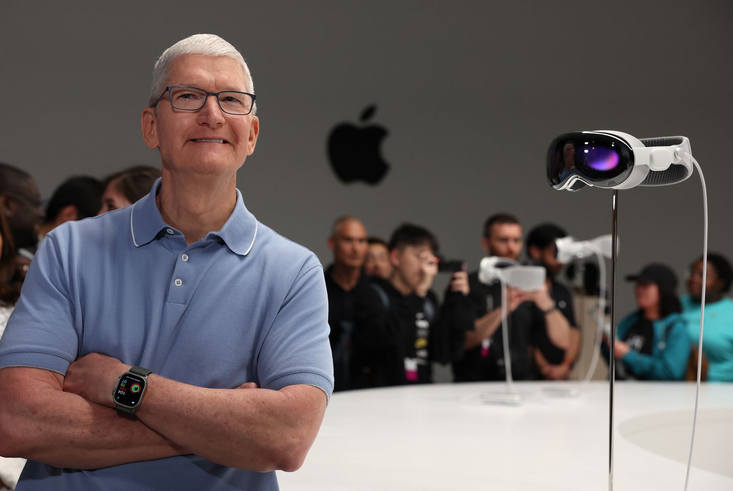 Apple CEO Tim Cook stands next to the new Apple Vision Pro headset at the Worldwide Developers Conference on June 5, 2023.
