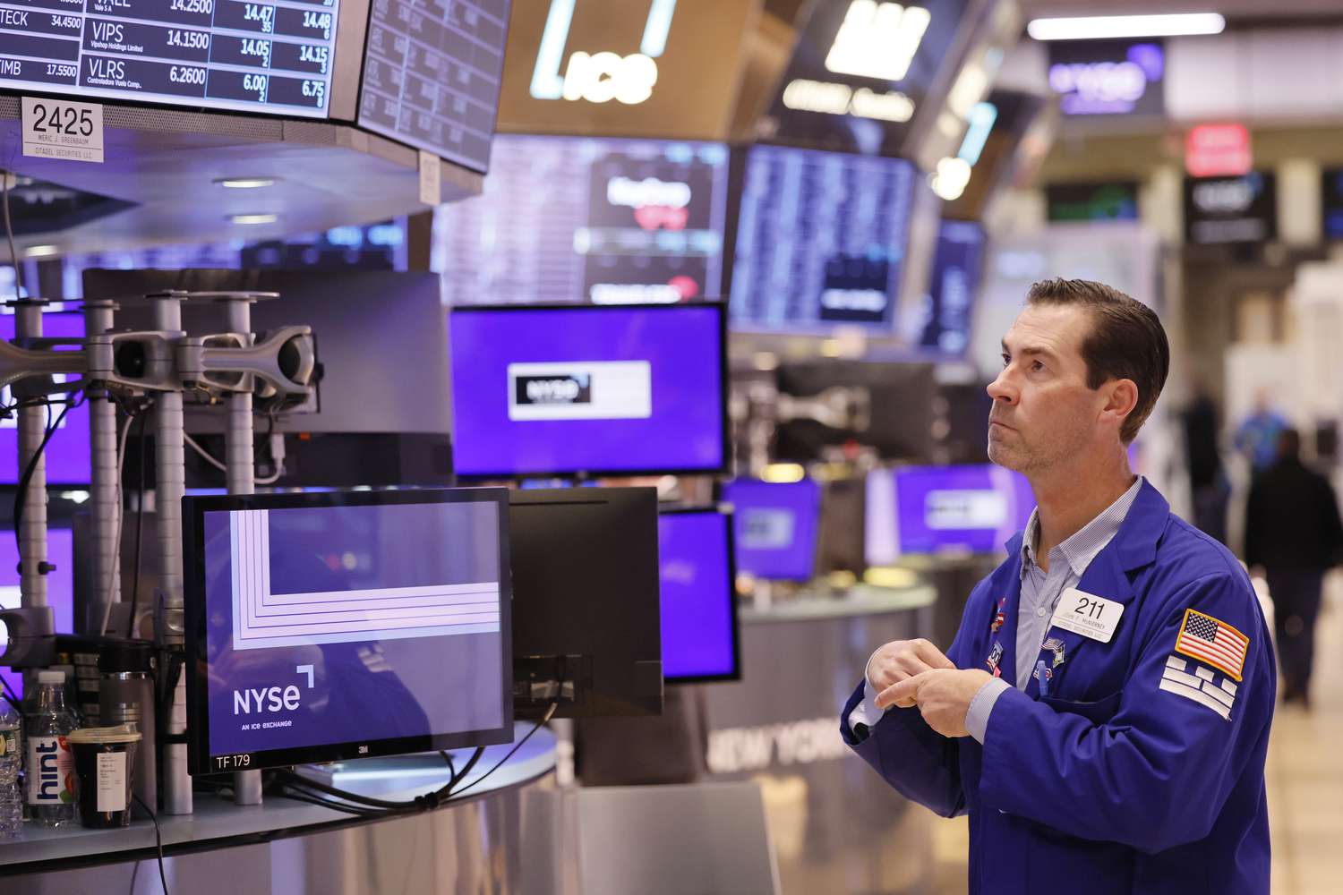 Traders work on the floor of the New York Stock exchange
