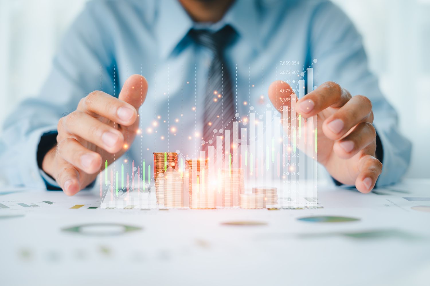 Person in a suit sitting with stock data in front of them