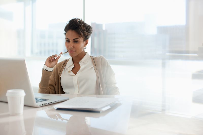 A woman reviews documents.