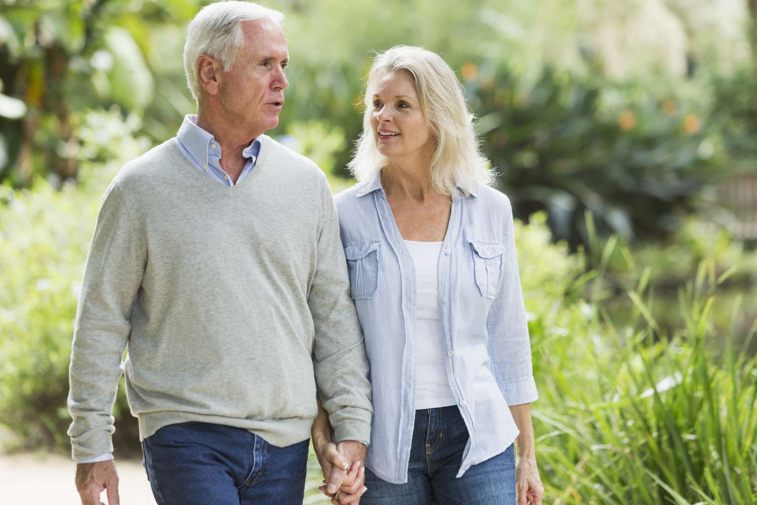Older couple walking outside