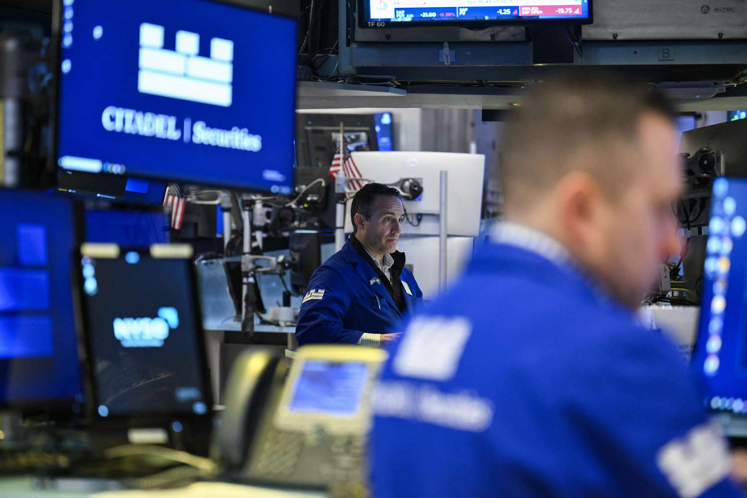 Traders work on the floor of the New York Stock Exchange (NYSE) at the opening bell in New York on April 29, 2025. Stock markets advanced on Tuesday following news that Donald Trump plans to spare automakers from some of his wide-ranging tariffs, boosting hopes of a less combative approach to his trade war.