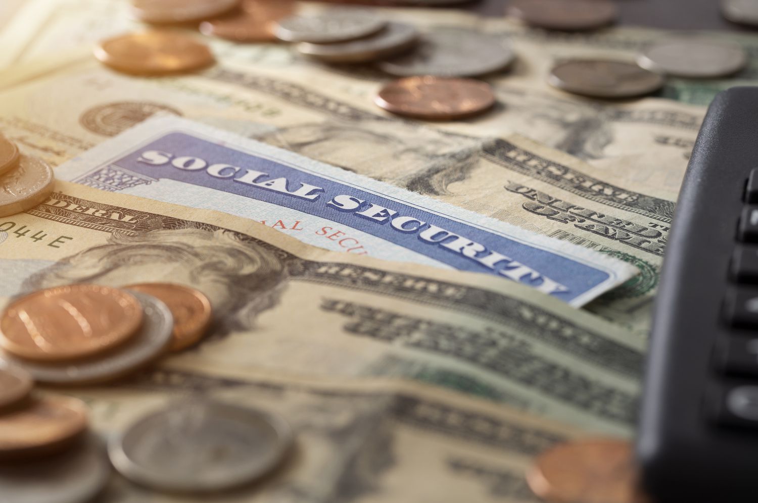 A social security card and pile of money.