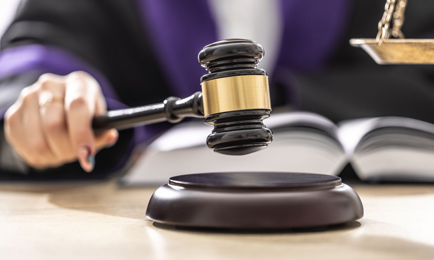 A judge bangs a gavel to end a hearing that determined punitive damages in a misrepresentation case.