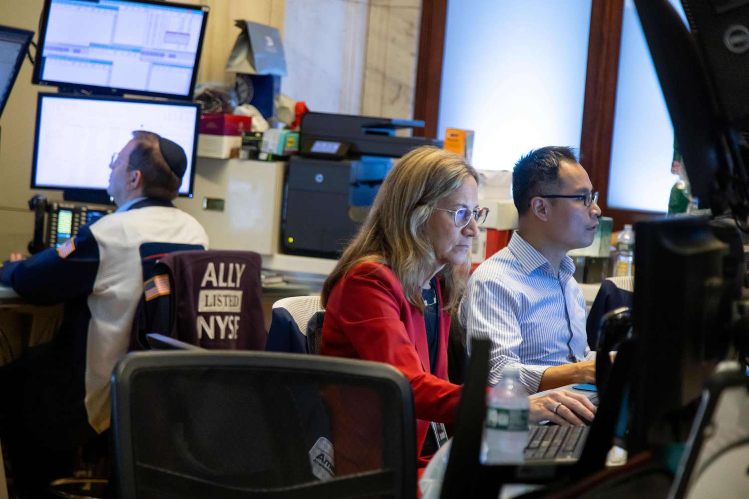 Traders work on the floor of the New York Stock Exchange.