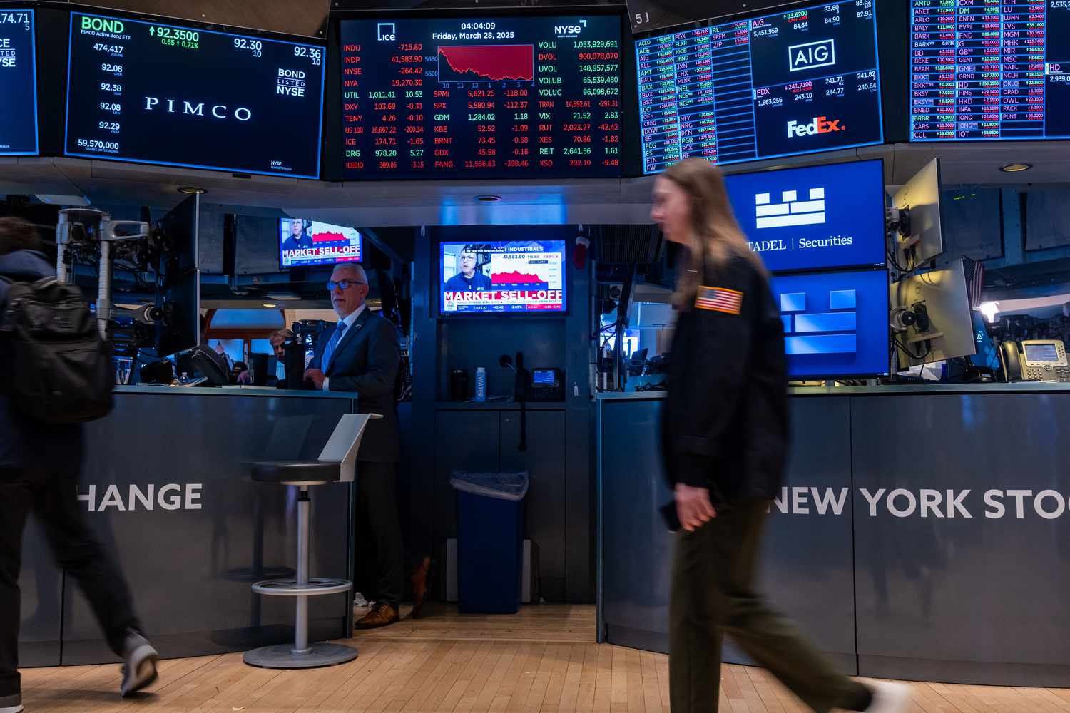 raders work on the floor of the New York Stock Exchange