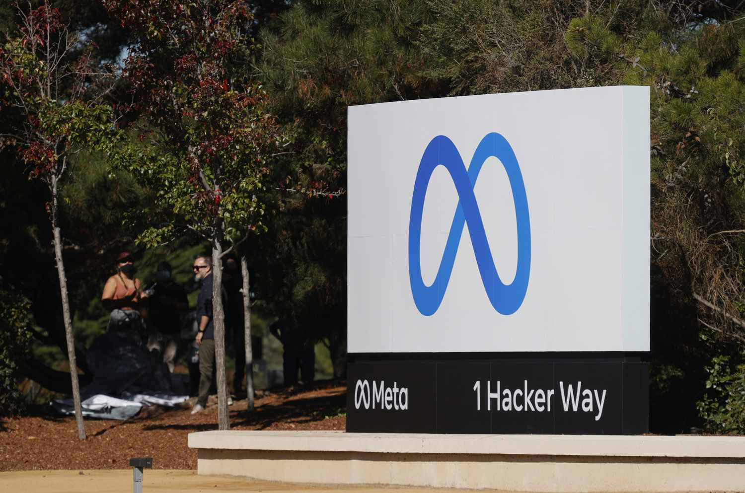 A sign with a new logo and the name Meta is displayed in front of Facebook headquarters in Menlo Park, California, on Oct. 28, 2021.
