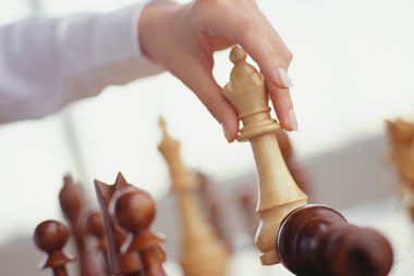Hand moving chess piece