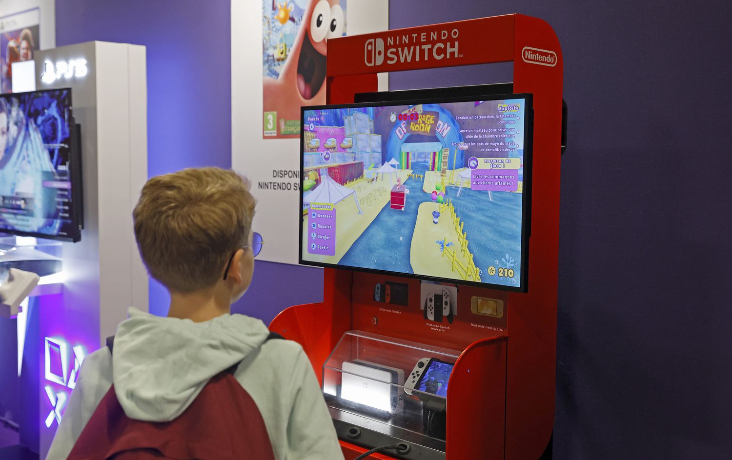 A gamer plays a video game on a Nintendo Switch game console.