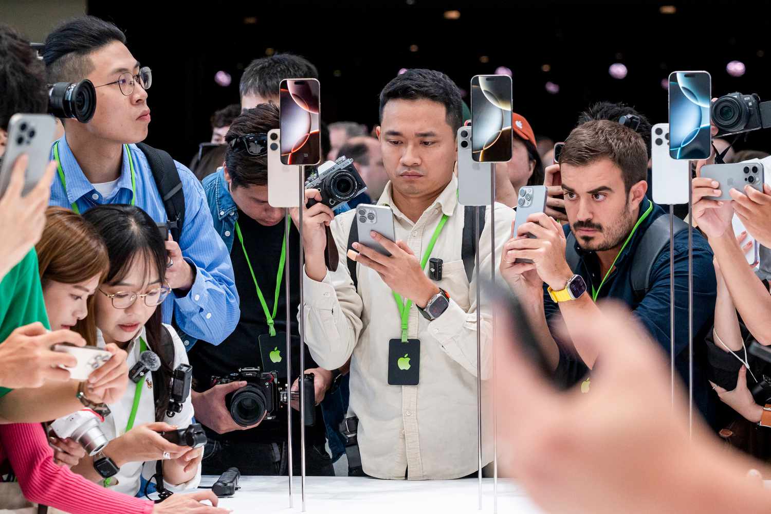 Attendees view new products during an event at Apple Park campus in Cupertino, California, US, on Monday, Sept. 9, 2024.