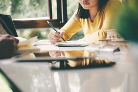 woman at desk studying