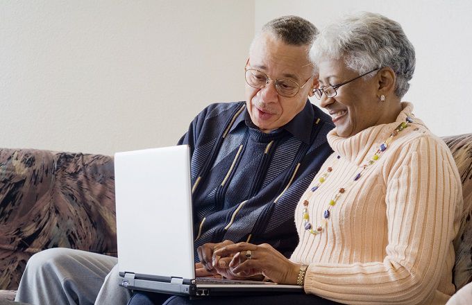 Senior African American couple at laptop