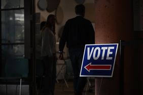 People wait to vote in Boulder, Colo., earlier today. 