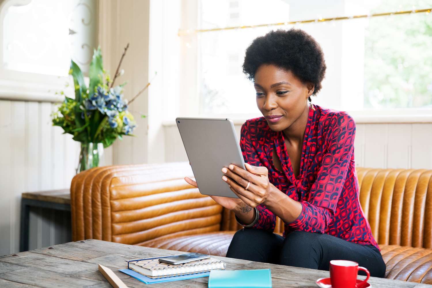 A woman uses a tablet