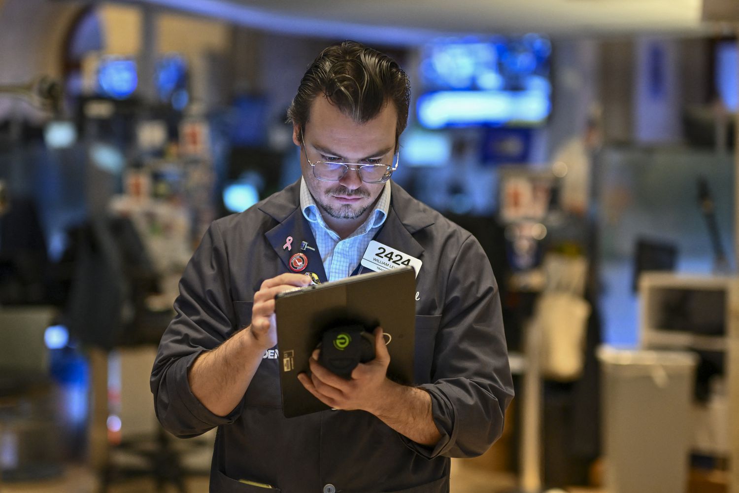 Traders work on the floor of the New York Stock Exchange