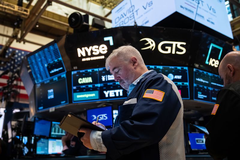 Traders work on the floor of the New York Stock Exchange.