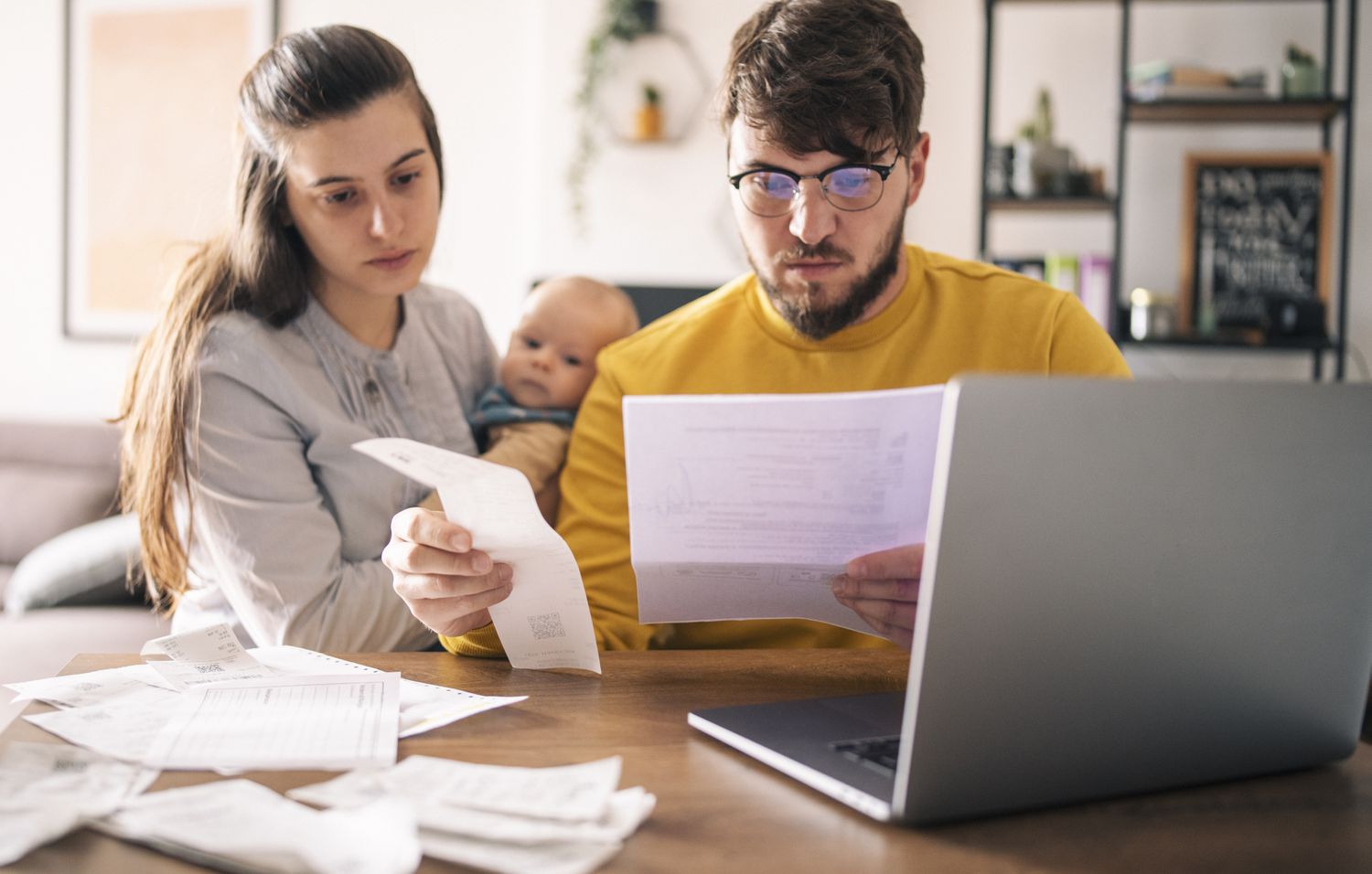 Young family paying bills