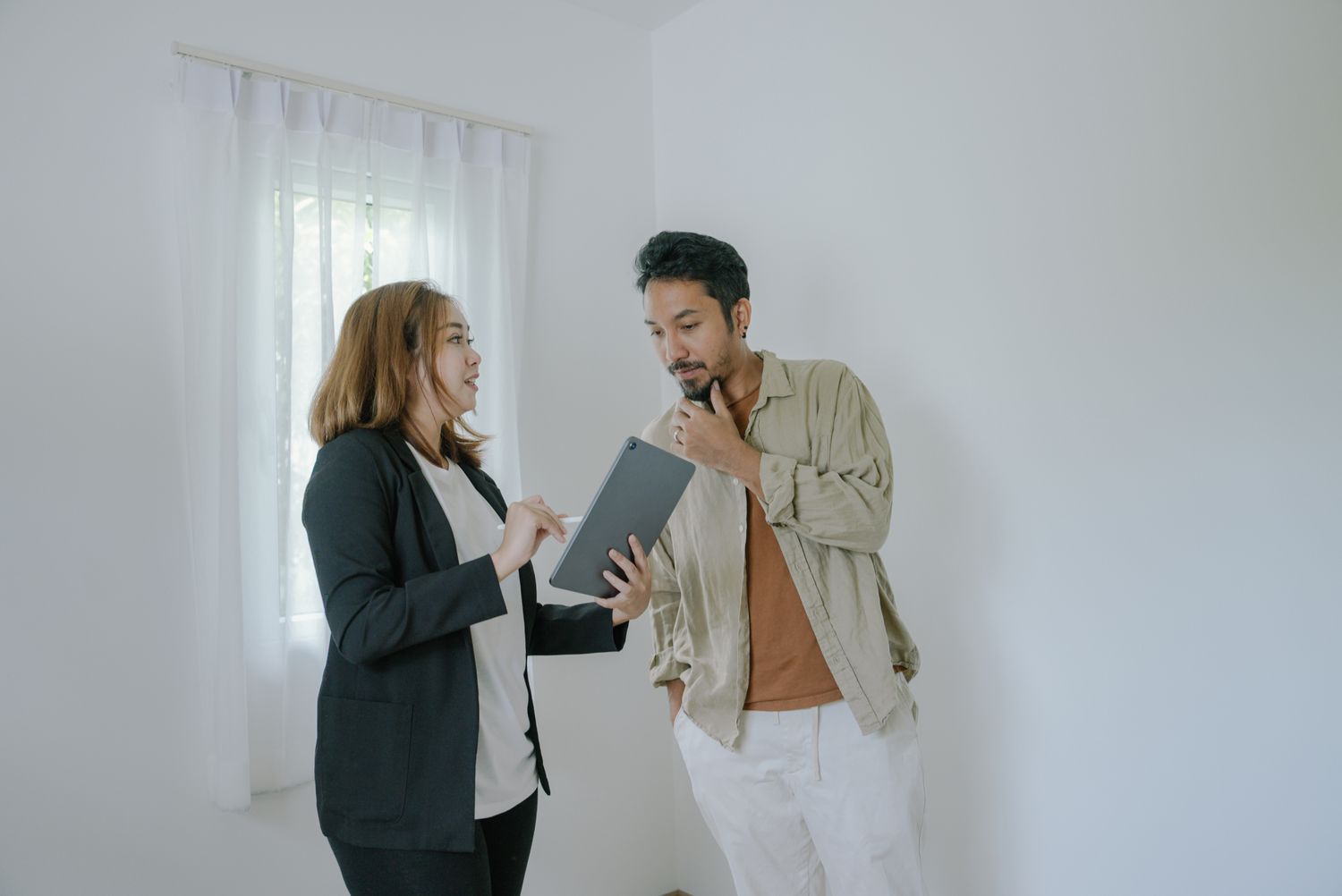 Inspector going over a property with a homebuyer.