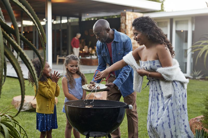 Family in Backyard of High-Value Home