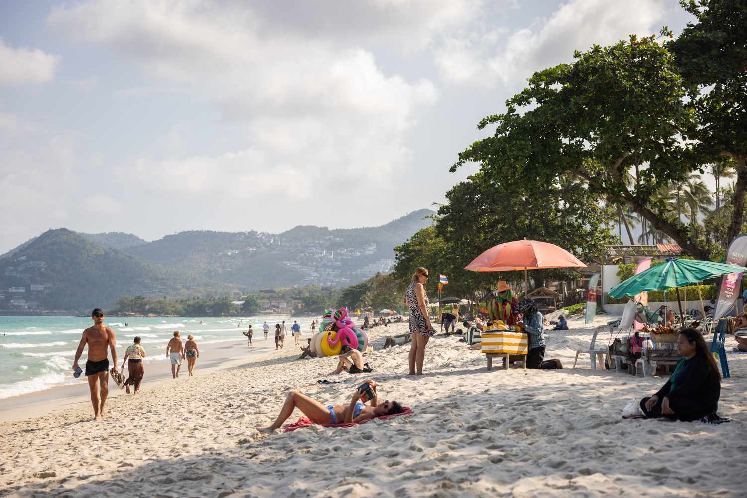 Tourists sunbathe on Chawang Beach, a 7km strip of sand on Samui's eastern coast