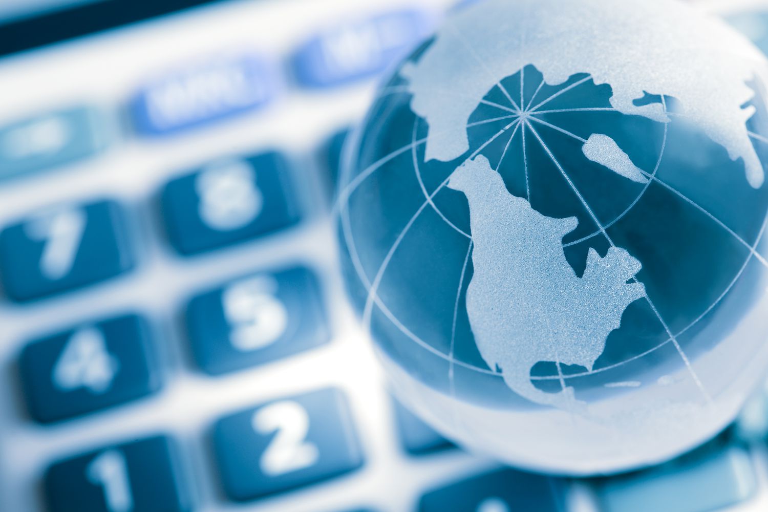Globe on calculator, america map