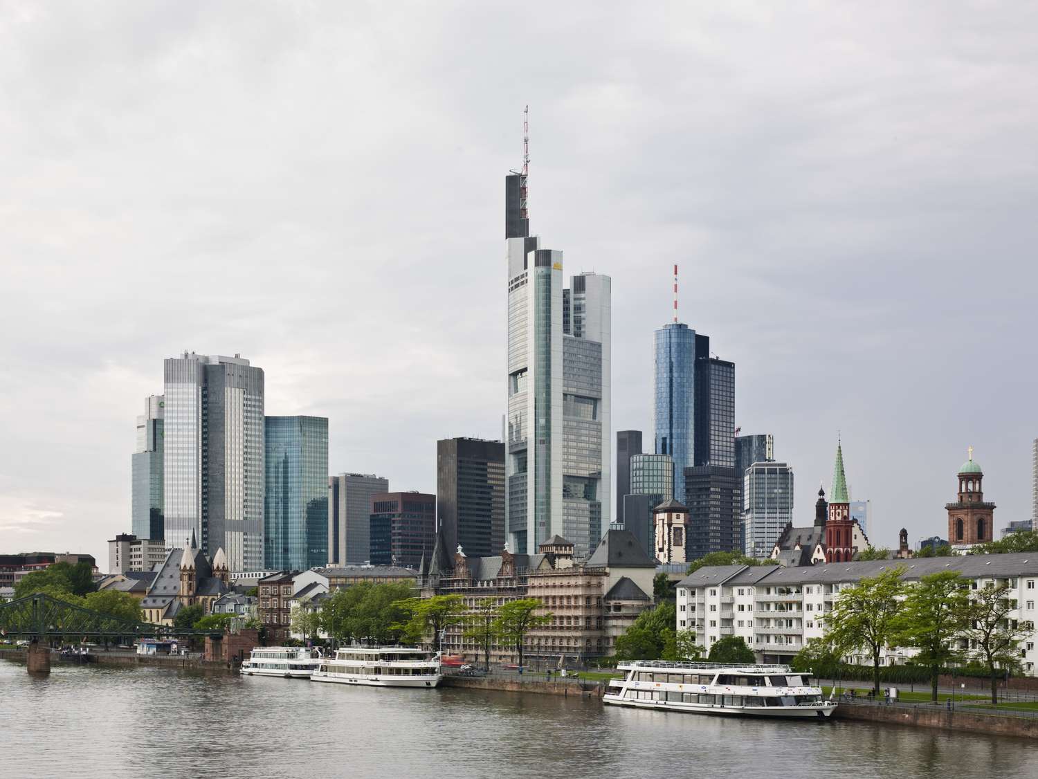 A view of the business district of Frankfurt Germany showing the Main river and the Commerzbank tower building.