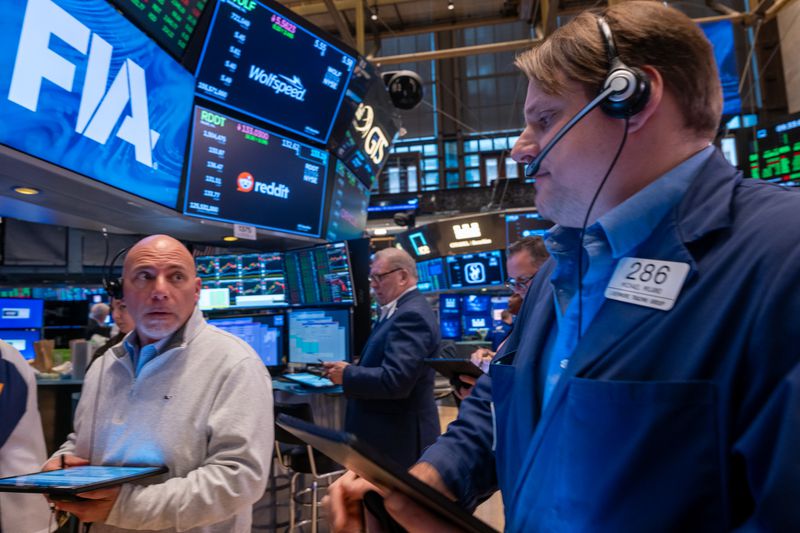 Traders work on the floor of the New York Stock Exchange
