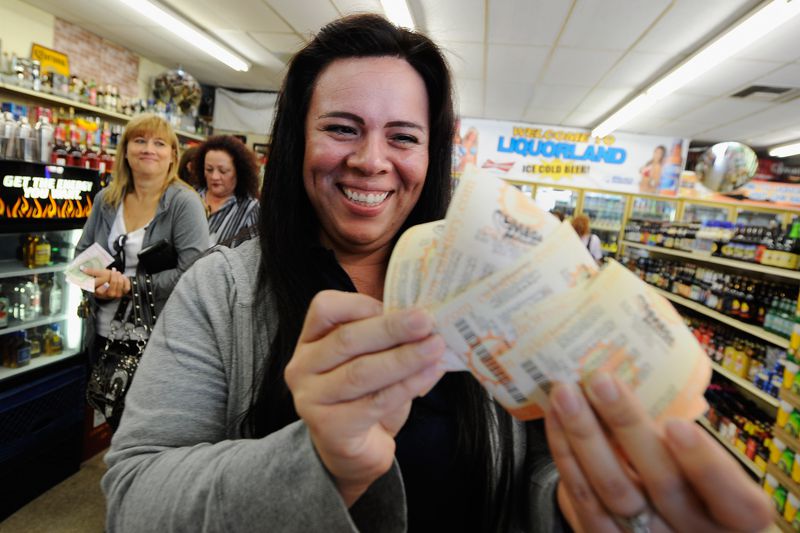 Image of a woman buying tickets for her lottery pool.