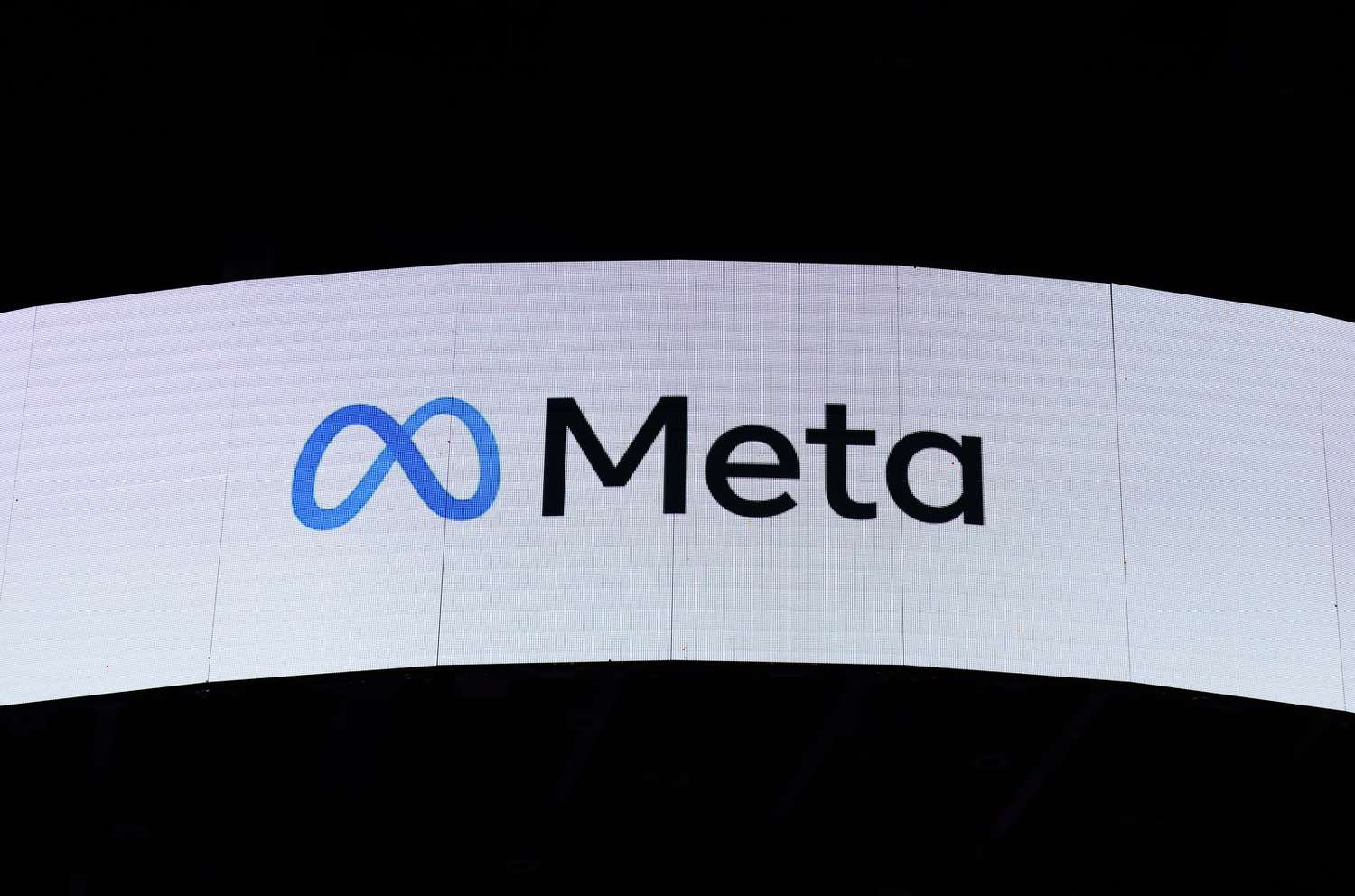 The Meta logo on display at an event.