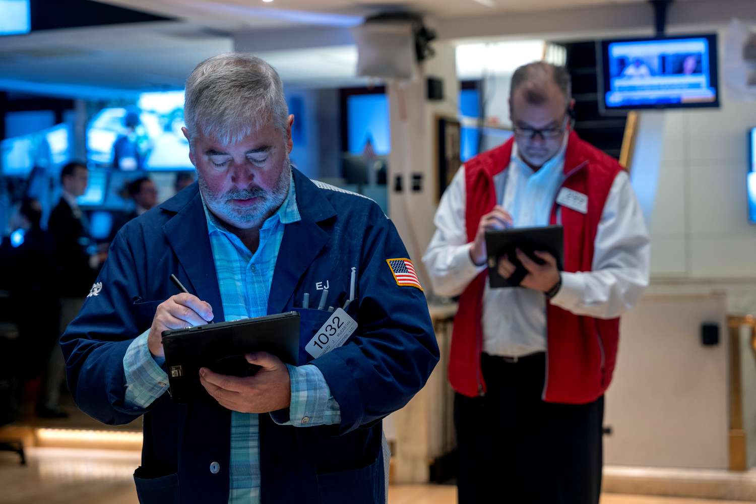 Traders work on the floor during morning trading at the New York Stock Exchange.