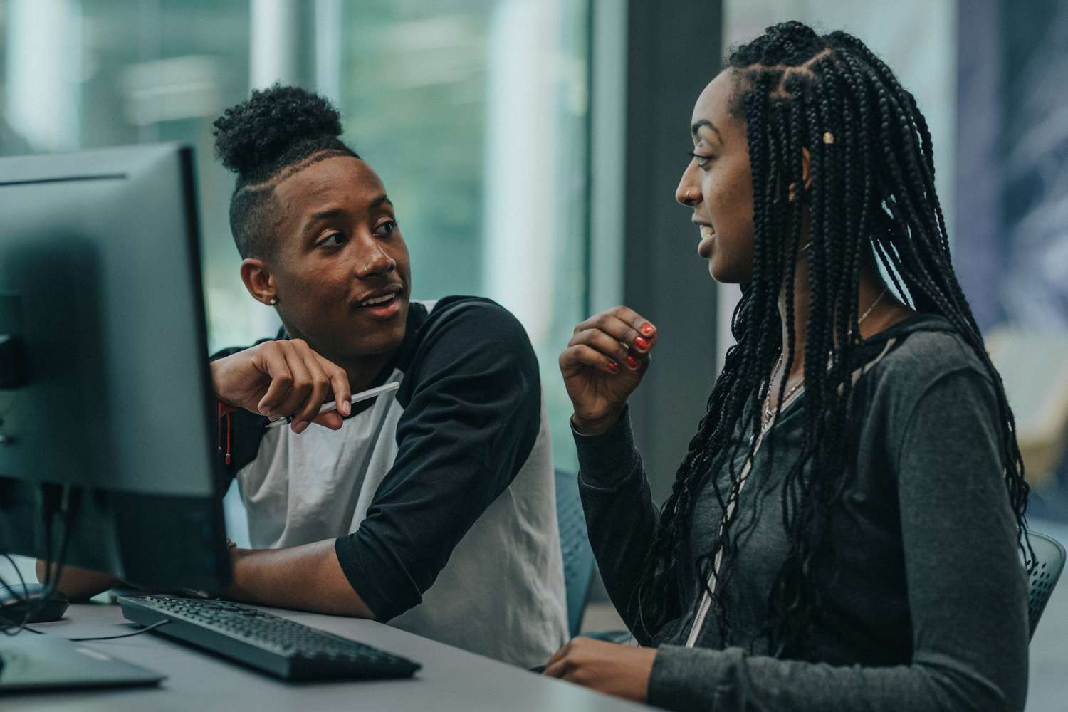 Two students in a computer lab
