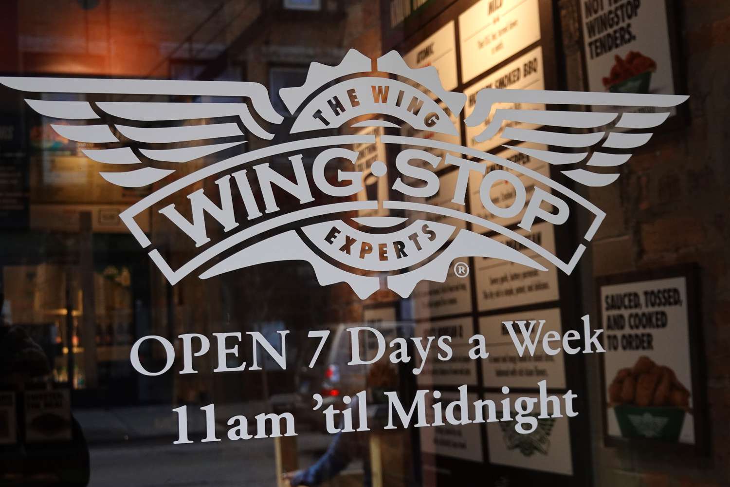 The Wingstop logo is seen on the front door of one of the company's restaurants.