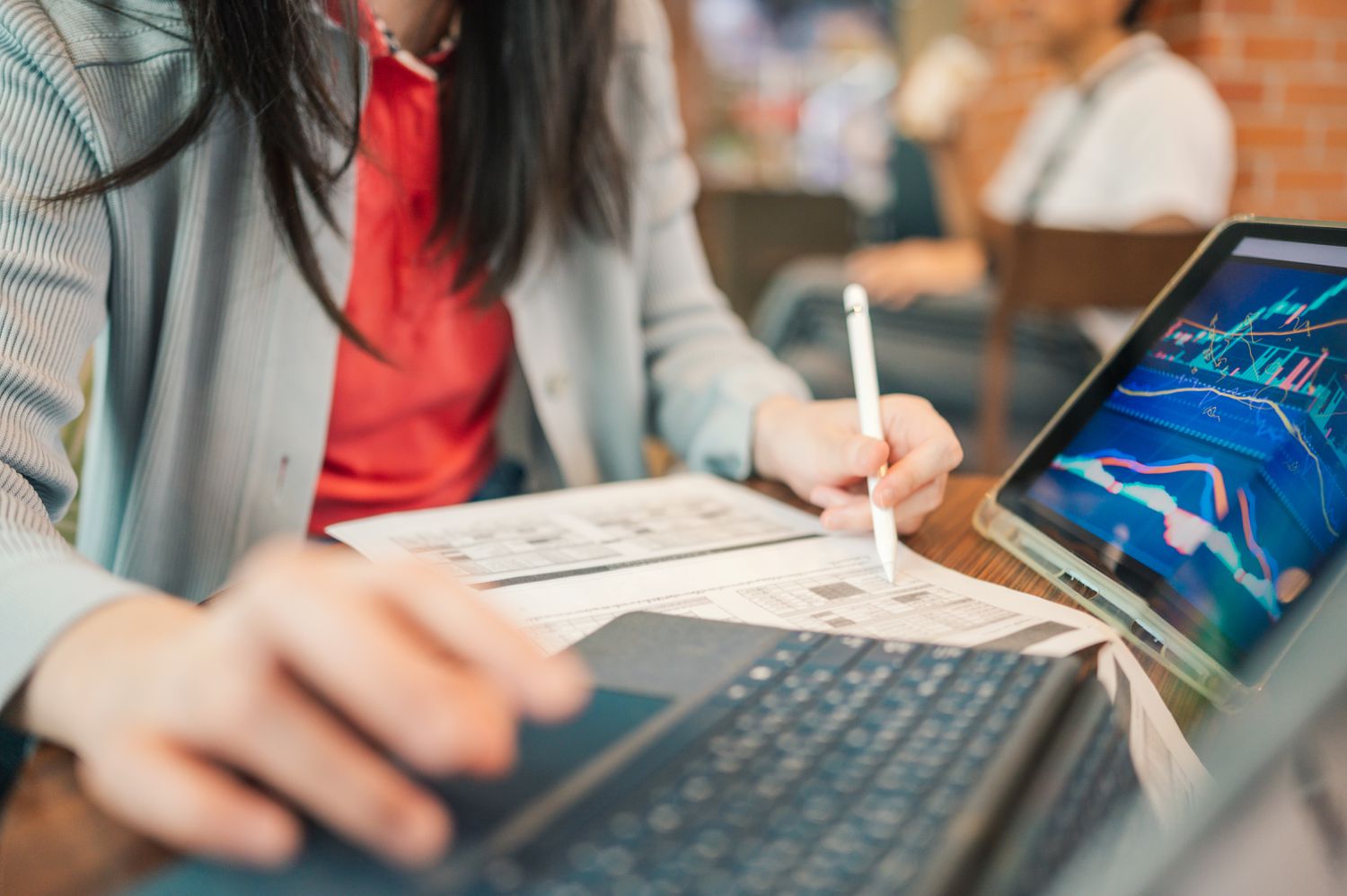 A woman looking at digital market data. 