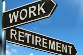 Signpost showing work as one arrow, retirement as the other