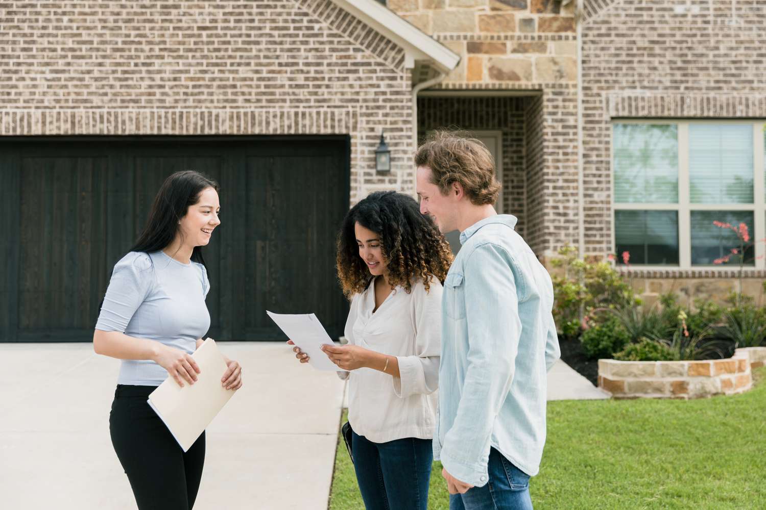 A couple is happy to receive absolute title for their new house after completing the purchase.