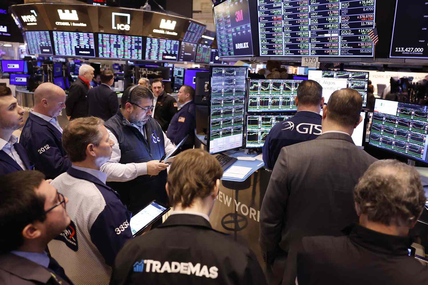 Traders work on the floor of the New York Stock Exchange.