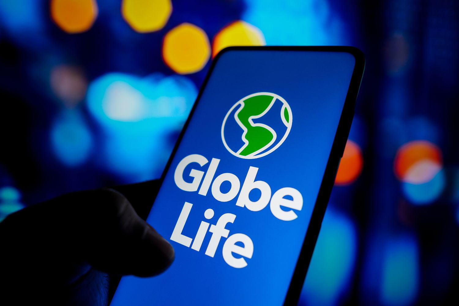 In this photo illustration, the Globe Life Insurance logo seen displayed on a smartphone screen.