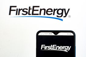 A pair of screens display the FirstEnergy logo.