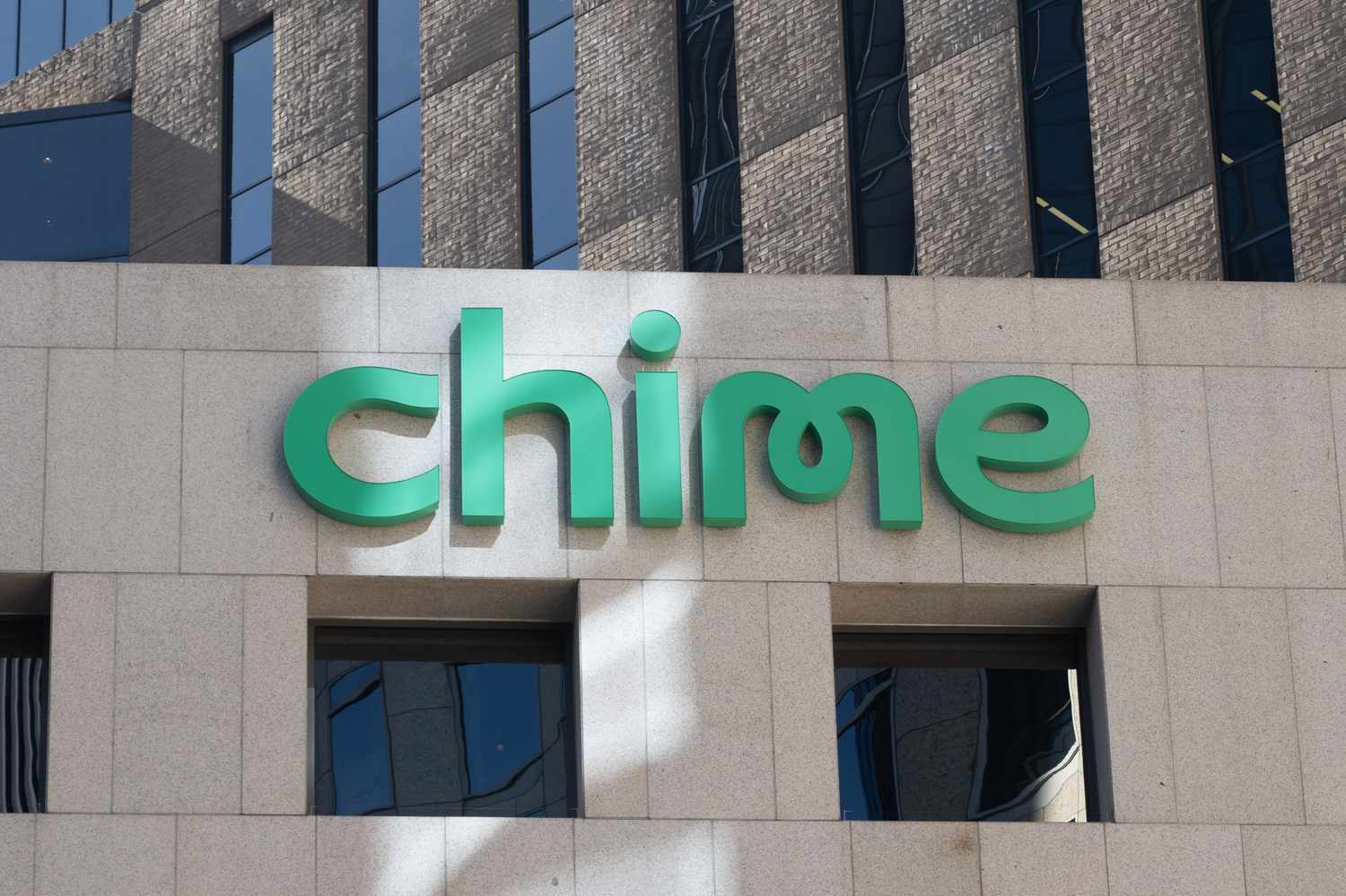 Facade featuring green Chime logo on a light stone building exterior, San Francisco