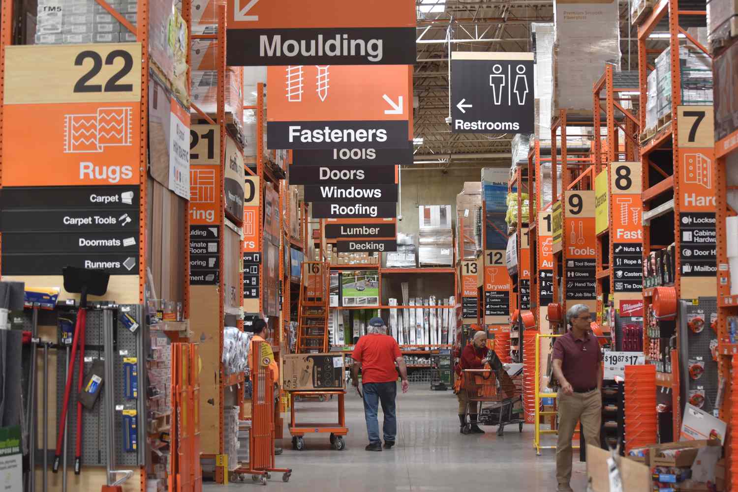 Customers shop at a Home Depot store in Arlington, Virginia, on March 14, 2024