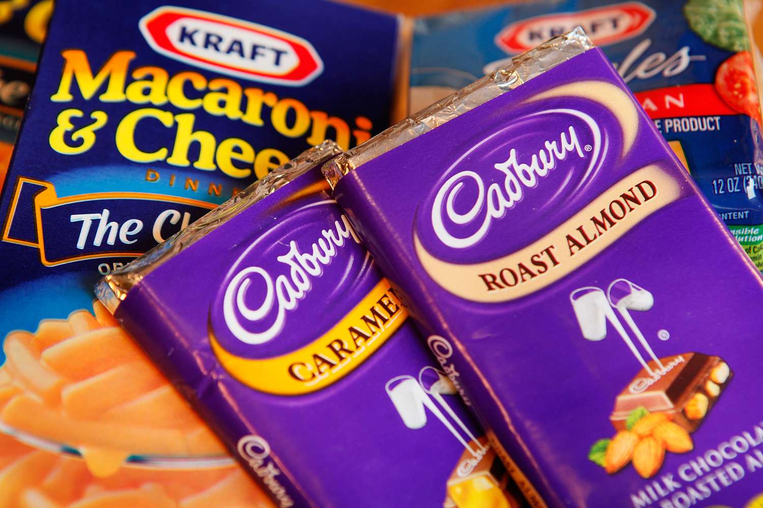Kraft brand Macaroni & Cheese and American Cheese Singles are displayed alongside Cadbury chocolate