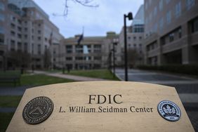 Street view of FDIC building showing building sign in the foreground