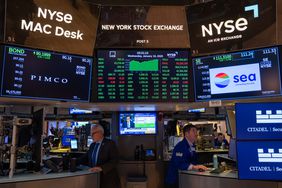 Traders work on the floor of the New York Stock Exchange (NYSE) 