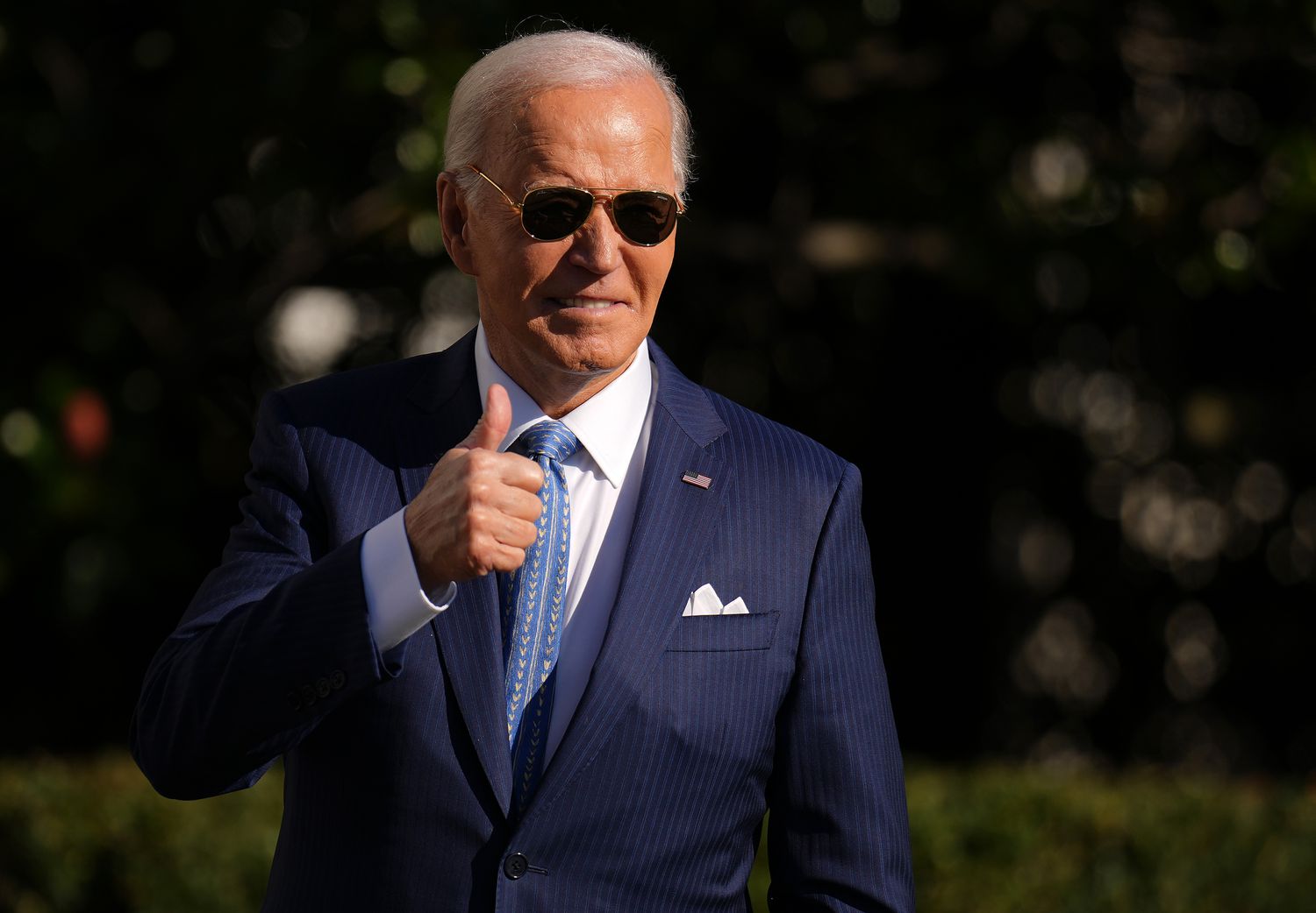 U.S. President Joe Biden motions to the audience after pardoning the National Thanksgiving Turkey Peach during a ceremony on the South Lawn of the White House on November 25, 2024 in Washington, DC.