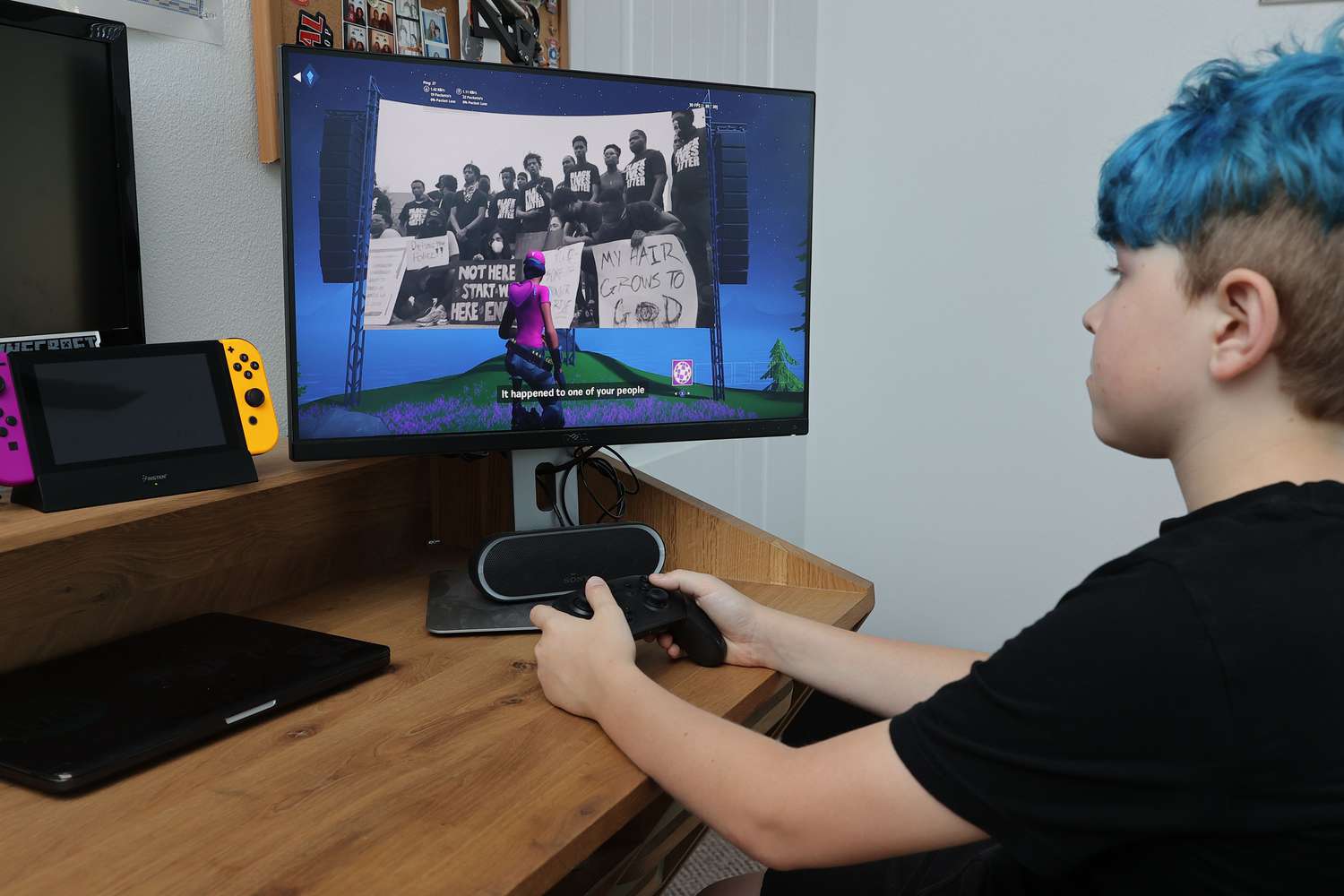  11-year-old Ansel, the photographerâs son, plays Fortnite for a special in-game showing of "We The People" at Fortniteâs Party Royale on July 04, 2020 in South Pasadena, California.