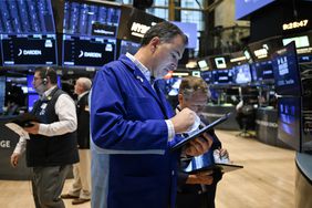 Traders work on the floor of the New York Stock Exchange (NYSE) at the opening bell on May 30, 2025, in New York City. 