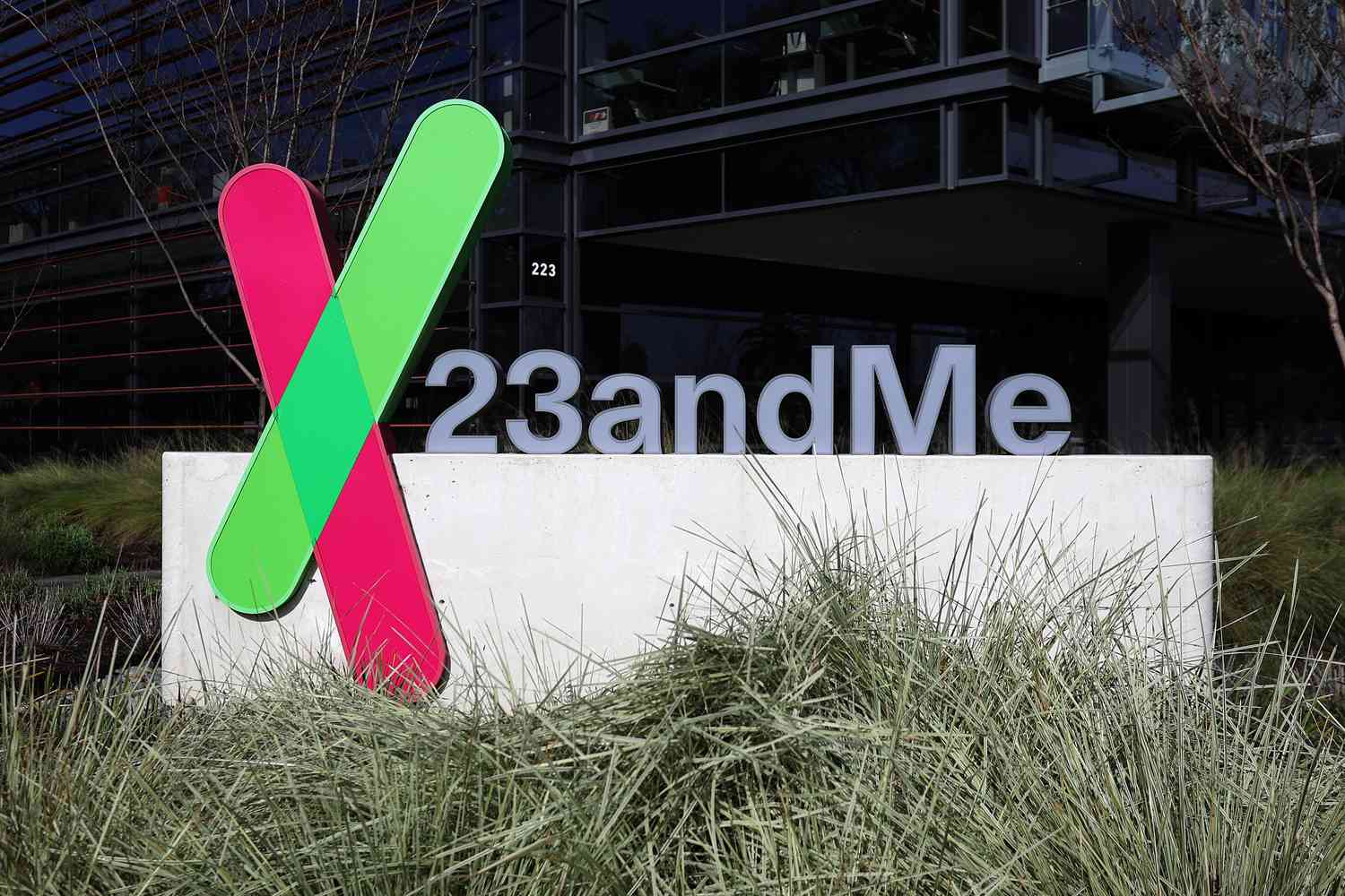 The green and red 23andMe logo is seen on a sign outside the company's office building.