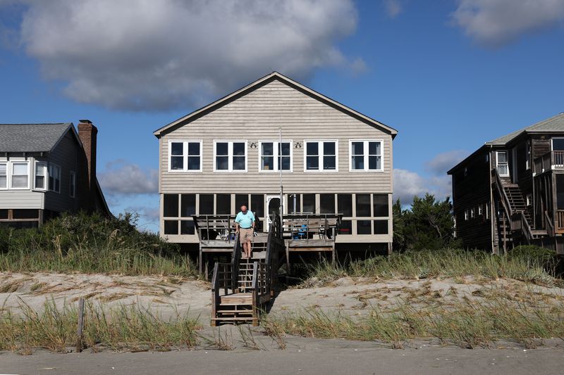 Man leaving his beachfront property