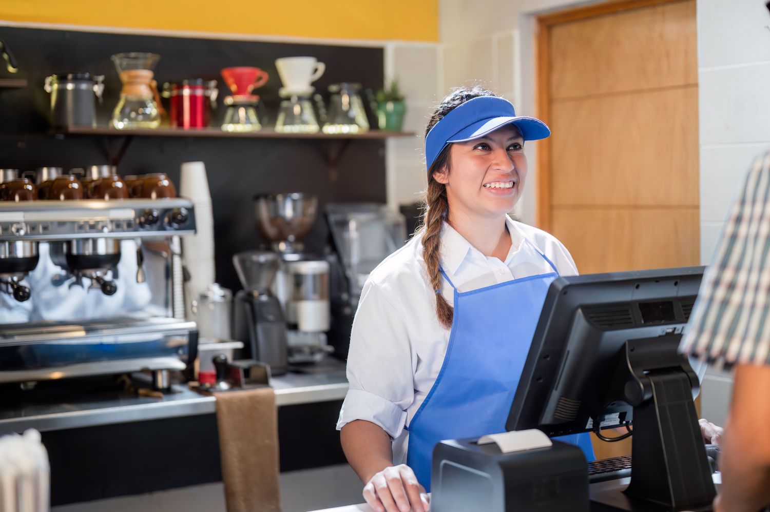 Cashier smiles at a customer