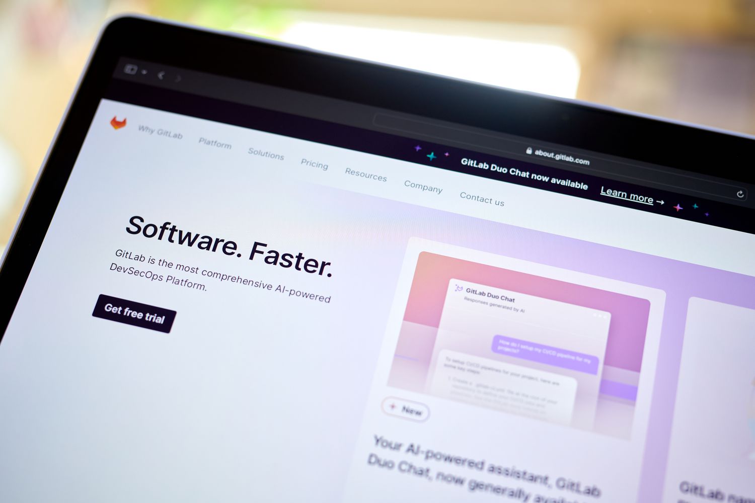 The GitLab website on a laptop screen.